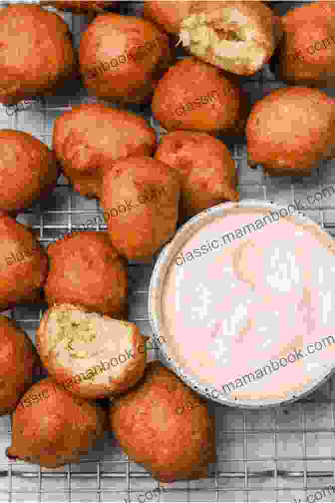 A Basket Filled With Freshly Fried Hush Puppies, Served With A Dipping Sauce. Southern Fried: More Than 150 Recipes For Crab Cakes Fried Chicken Hush Puppies And More