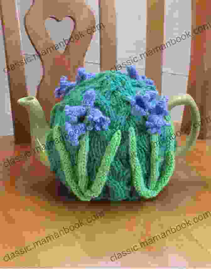 A Bluebell Tea Cosy Knitted In Blue And Green Yarn. Bluebell Tea Cosy: Knitting Pattern